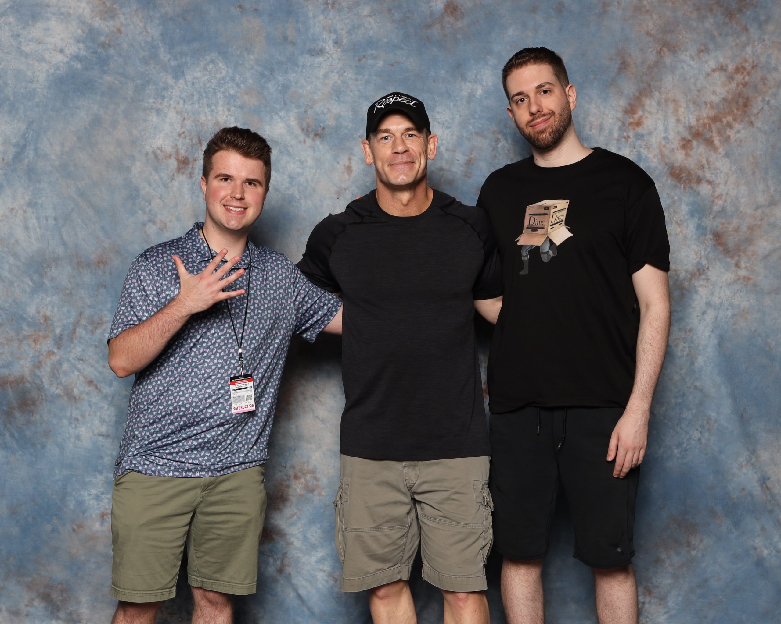 Author of Page on the left standing with John Cena and his older brother